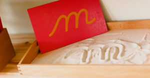 Schreibtablett mit Sand